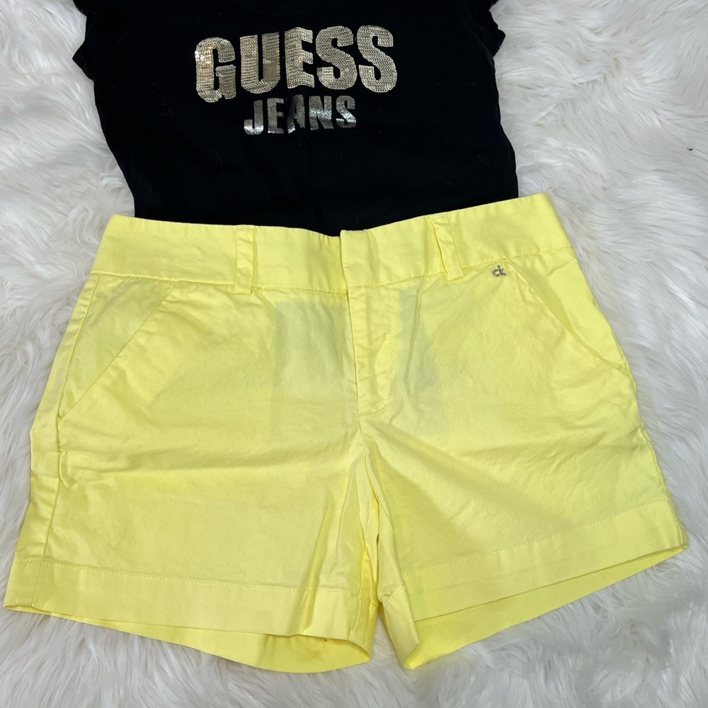 Calvin Klein yellow shorts. Size 4